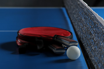 Wall Mural - Ping pong. Accessories for table tennis racket and ball on a blue tennis table. Sport. Sport game.