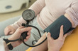 © LStockStudio - Doctor Measuring Blood Pressure