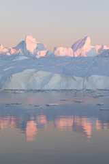 Wall Mural - beautiful iceberg in the pink and purple alpenglow light. disko bay, greenland.