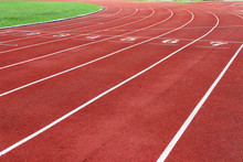 Photo Of Red Running Track For Competition Or Exercise, As Background. Sports Concept. Colorful Tone.