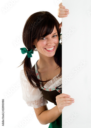 Fotografie, Obraz Smiling St Patrick's Oktoberfest Girl Holding A Blank Sign Copy Space