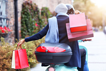 Sticker - Portrait of happy couple with shopping bags after shopping in city