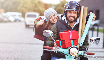 Sticker - Portrait of happy couple with shopping bags after shopping in city