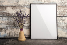 Mock Up Of An Empty Frame Poster On A Wall Of Wooden Boards. A Bunch Of Lavender In A Vase