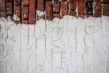 Wall Mural - the texture of an old brickwork with fragments of white plaster