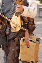 Man Playing A Medieval Rebec Instrument