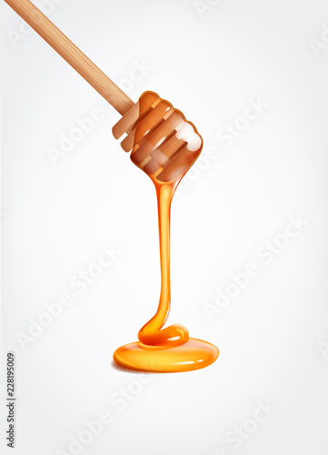 Photographie Honey flowing, dripping from wooden dipper stick.