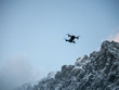 © Peter - Drone hovering against Blue sky.