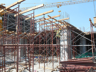 Wall Mural - Scaffolding used as the temporary structure to support platform, form work and structure at the construction site. Also used it as a walking platform for workers. 