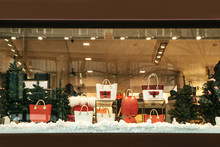 Shop Window Decorated In Christmas Style. Christmas And New Year Sales. Many Different Handbags And Other Items Are Sold In Stores.