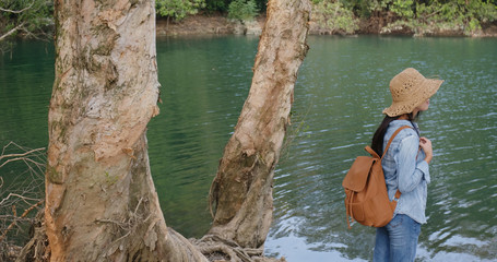Wall Mural - woman enjoy the view of the lake