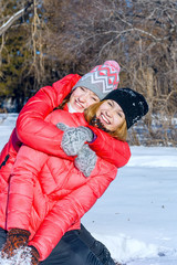 outdoor portrait of two girls  have fun and enjoy the fresh snow on a beautiful winter day in winter park