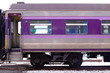 Cropped image of purple bogie of  train on railway.