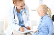 © rogerphoto - Doctor and a little blonde girl. Medicine and healthcare concept