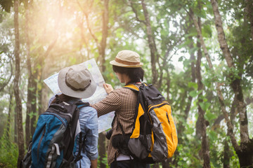 Two Young Tourists With Backpacks Sightseeing nature