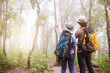 © thitipong - Two Young Tourists With Backpacks Sightseeing nature