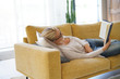 © goodluz - Middle-aged woman at home reading book