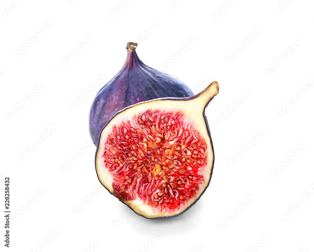 Whole and cut purple figs on white background