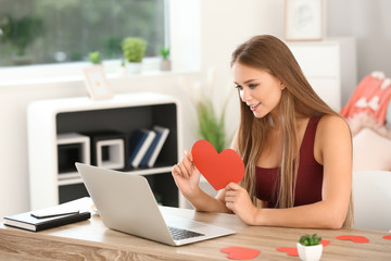 Poster - Young woman with laptop having online dating at home