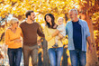 © Mediteraneo - Multl generation family in autumn park having fun