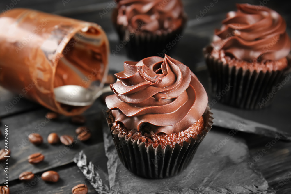 Delicious chocolate cupcake on slate plate