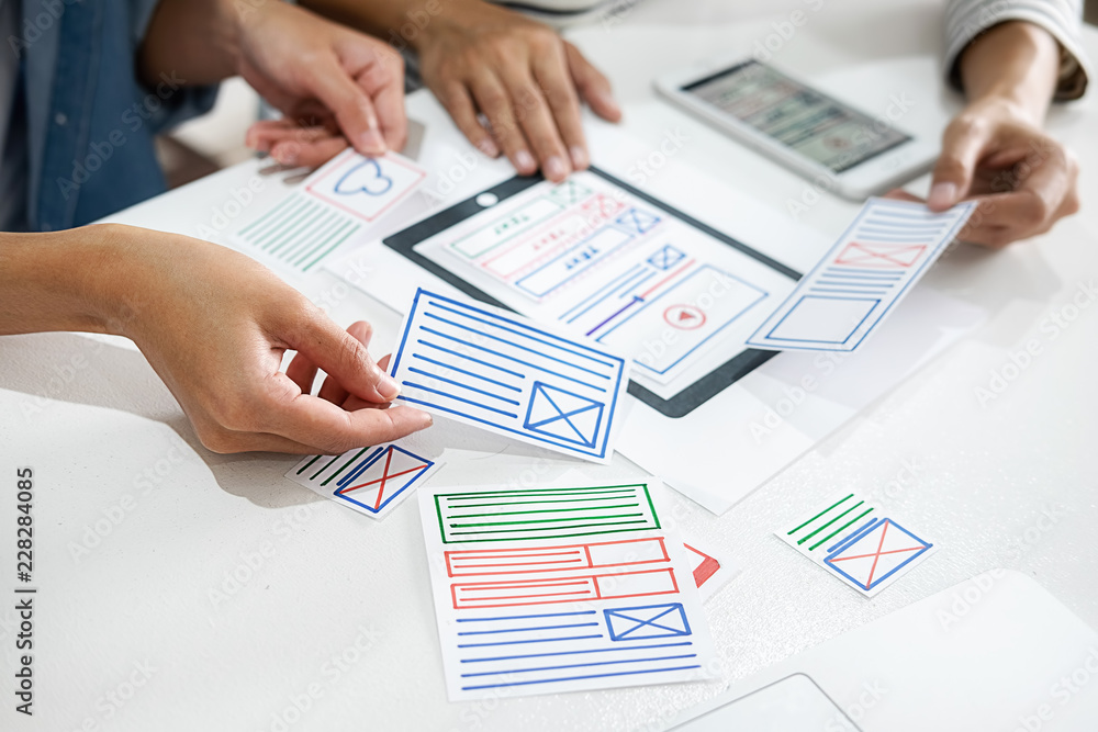 Creative Web Designer planning application and developing template layout, framework for mobile phone. User experience (UX) concept.