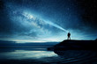 A person standing and watching the Milky Way galaxy rise into the night sky. Photo Composite