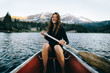 © Forrest Smith - Smiling woman in canoe
