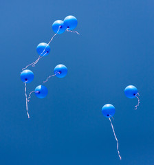 blue balloons in the blue sky