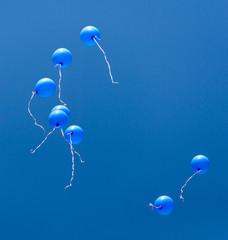 blue balloons in the blue sky
