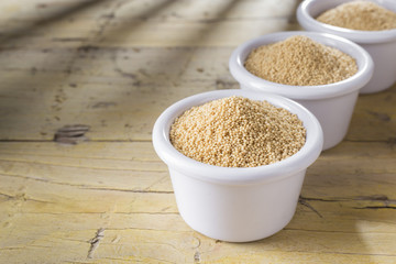 Wall Mural - amaranth beans in bowl, on rustic wooden background