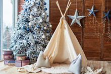 Christmas Tree With Gifts And Wigwam Near Window In Child Room, Copy Space. Christmas Decorations. Childen Room Interior With Decorated Play Tipi Tent. Scandinavian Style