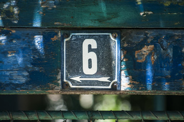 Wall Mural - Weathered grunge square metal enameled plate of number of street address with number 6 closeup