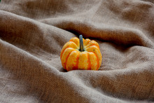 Orange Pumpkin On Rumpled Sackcloth.