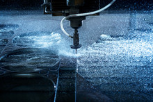 Water Jet Industrial Machine Cutting Steel Plate. Computer Controlled Metalworking Machine Using High Pressure Water Jet To Cut Metal.