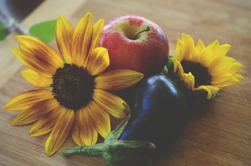 Fresh picked Apples, Eggplant, and Sunflower shot in Puerto Rico. Organic farming, fresh farmers market fall harvest. Delicious organic food. 