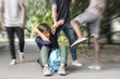 © Pixel-Shot - Aggressive teenagers bullying boy outdoors, view with motion blur effect