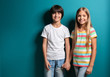 © Pixel-Shot - Smiling boy and girl in t-shirts holding hands on color background