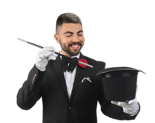 Wall Mural - Male magician showing tricks with hat on white background