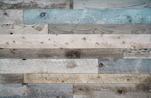Pale Faded Brown And Cool Blue Reclaimed Wood Surface With Aged Boards Lined Up. Wooden Planks On A Wall Or Floor With Grain And Texture. Neutral Stained Vintage Wood Background.