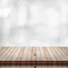 Sticker - Empty wooden table with blur shopping mall background.