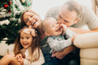 © Strelciuc - Loving family with kids embracing at home