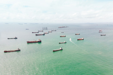 Wall Mural - Aerial view of sea freight at sun rise, Crude oil tanker lpg ngv at industrial estate Thailand / Crude Oil tanker to Port of Singapore - import export around in the world