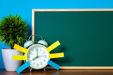 Wall Mural - Note paper sticky and vintage alarm clock and blank green chalkboard on table with copy space for add text notice something, list memo and schedule concept.