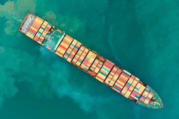 Fresh colorful Container cargo ship, Business International trade and Container logistics export-import harbor to the International port / Shipping Containers concept. Bird's-eye view from drone.