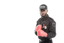 Serious African American Police Officer With Boxing Gloves Isolated On White, Fighting Aids Concept