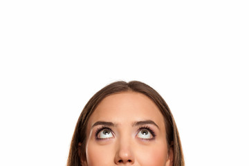half portrait of a young girl looking up on white background