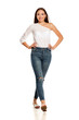 © vladimirfloyd - young beautiful girl in jeans walking on white backgeound