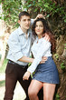 © soleg - young couple walking in the forest, posing near tree, summer nature, bright sunlight, shadows and green leaves, romantic feelings