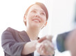 © ASDF - closeup of business woman shaking hands with her business partner.